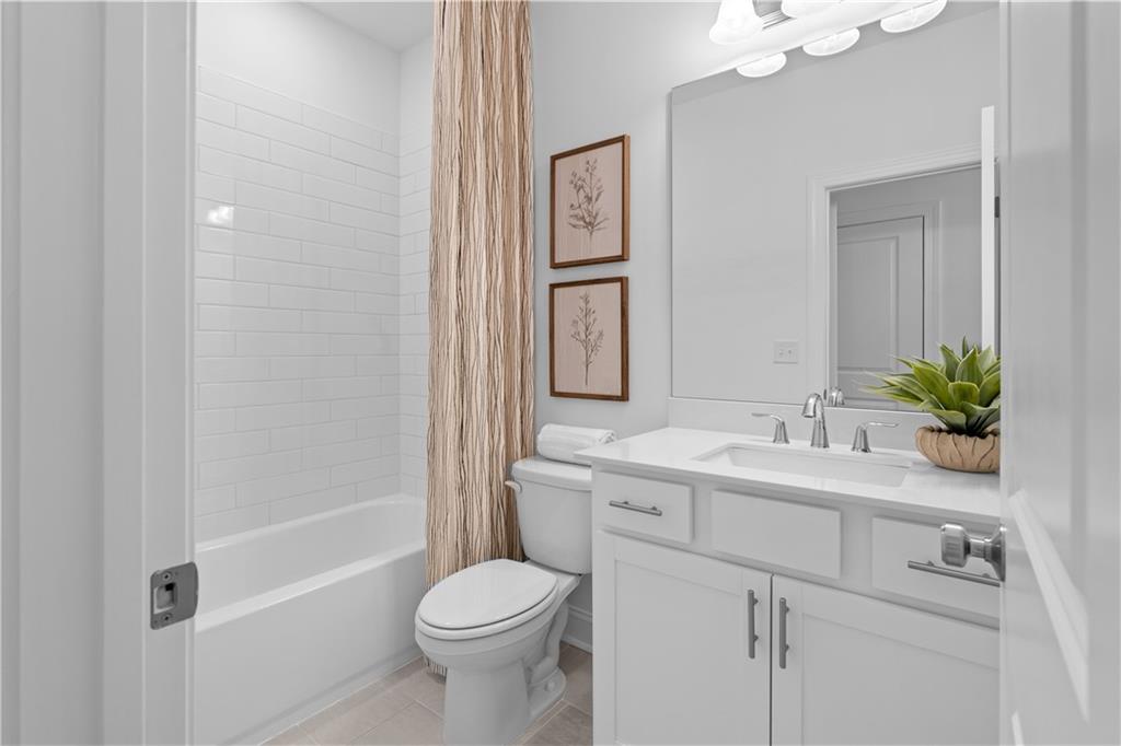 538 Alice Way, Unit D3 Cumming, GA 30040 - Photo 21 of 52 a bathroom with a sink a toilet and shower