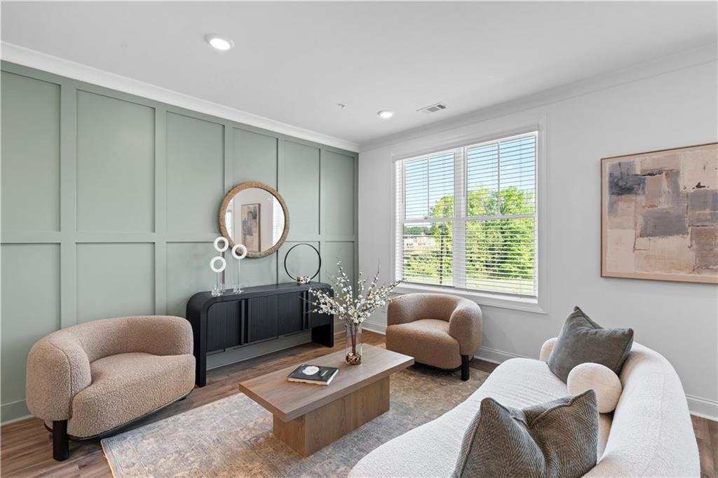 538 Alice Way, Unit D3 Cumming, GA 30040 - Photo 8 of 52 a living room with furniture a rug and a window