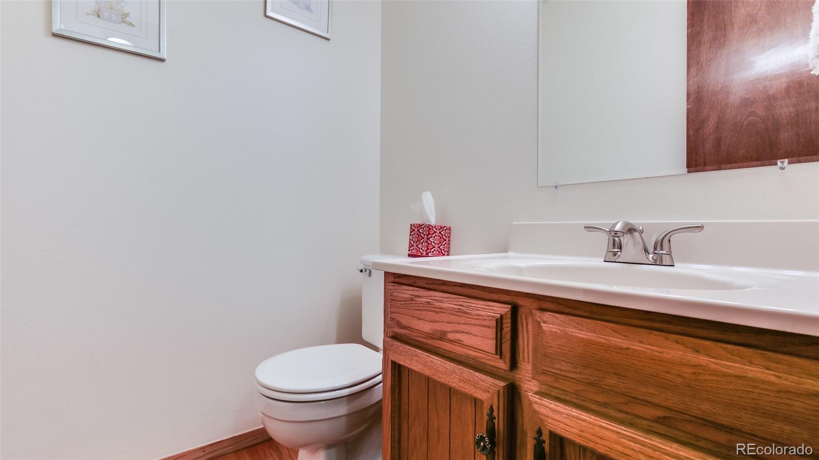 82 Prairie Ridge Road Highlands Ranch, CO 80126 - Photo 15 of 29 a bathroom with a sink and a toilet