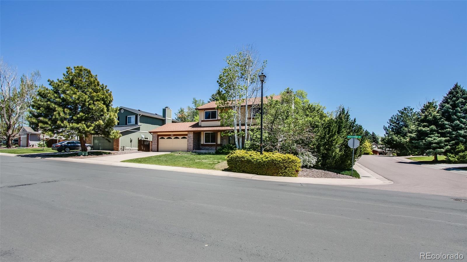 82 Prairie Ridge Road Highlands Ranch, CO 80126 - Photo 2 of 29 a view of a house with a yard and potted plants
