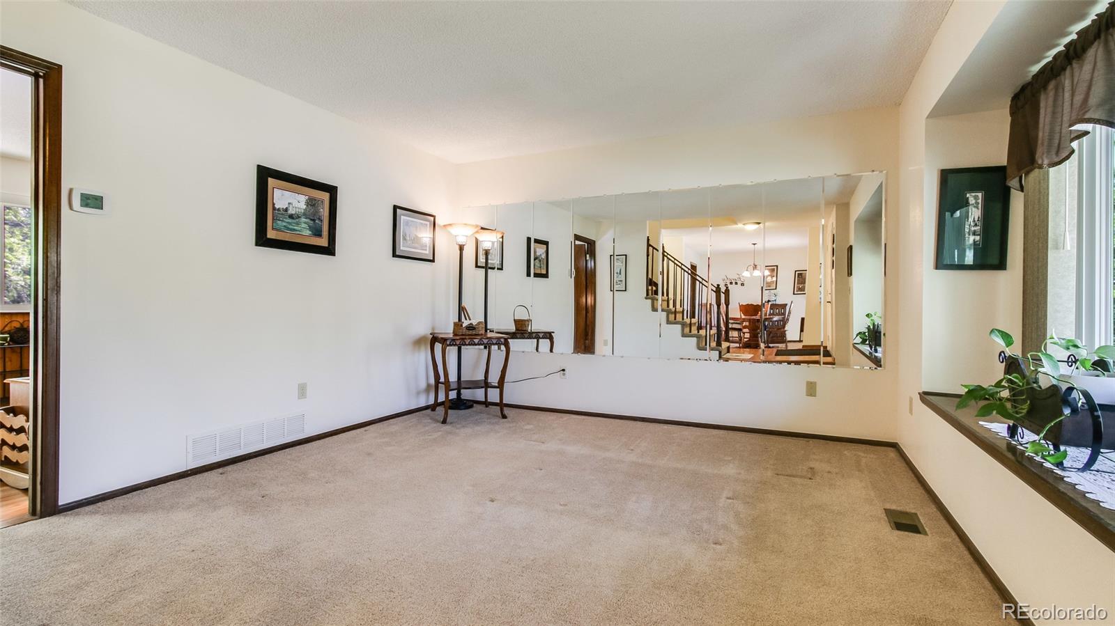 82 Prairie Ridge Road Highlands Ranch, CO 80126 - Photo 4 of 29 a view of an empty room with a window