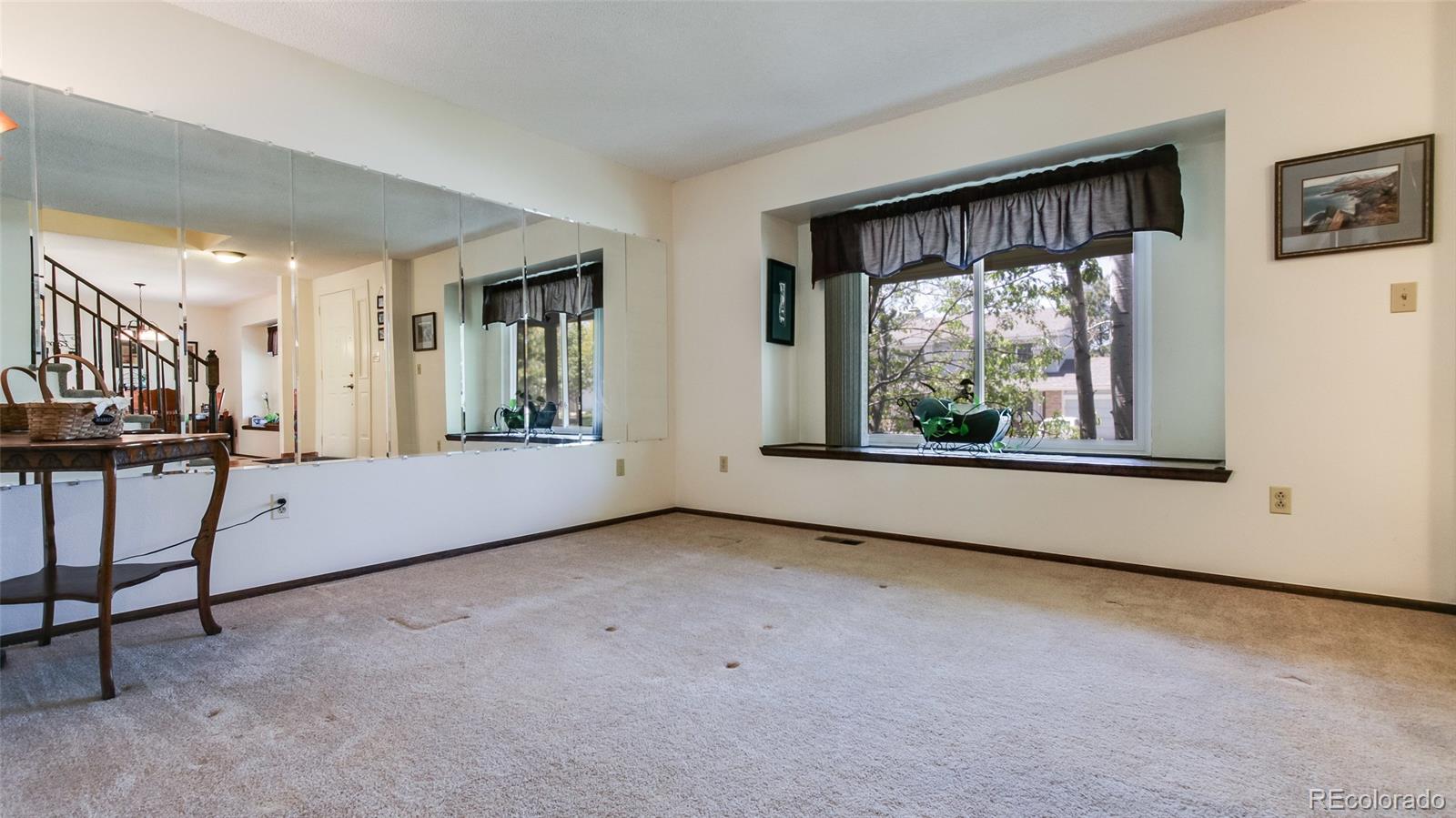 82 Prairie Ridge Road Highlands Ranch, CO 80126 - Photo 5 of 29 a view of an empty room with a window