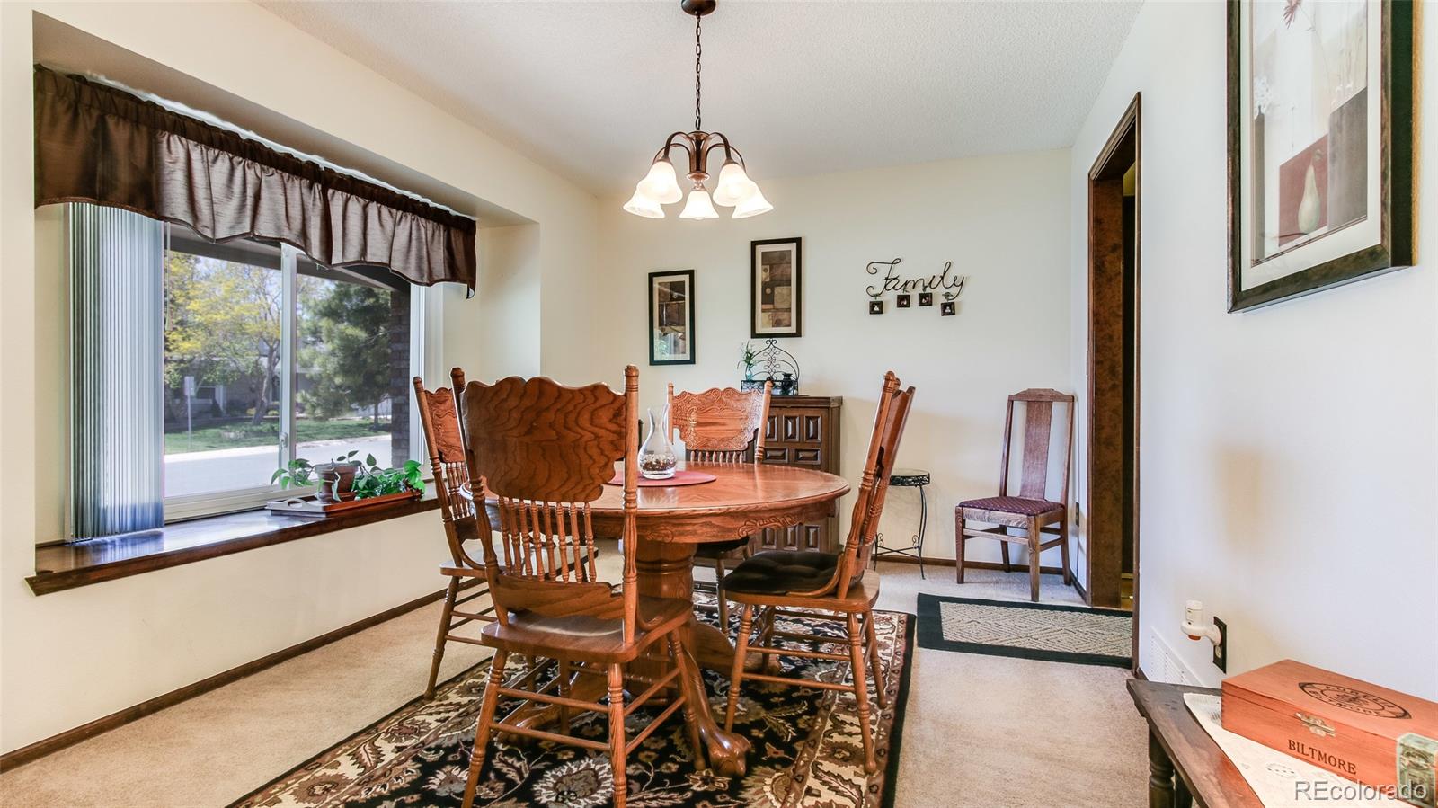 82 Prairie Ridge Road Highlands Ranch, CO 80126 - Photo 6 of 29 a view of a dining room with furniture window and outside view