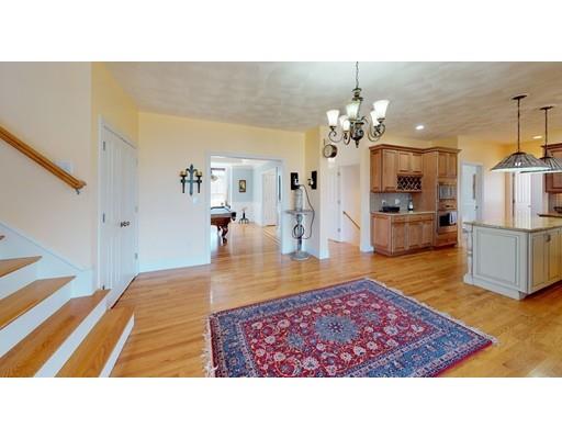 289 Washington Street Groveland, MA 01834 - Photo 5 of 30 a living room with stainless steel appliances kitchen island granite countertop a rug kitchen view and a faucet