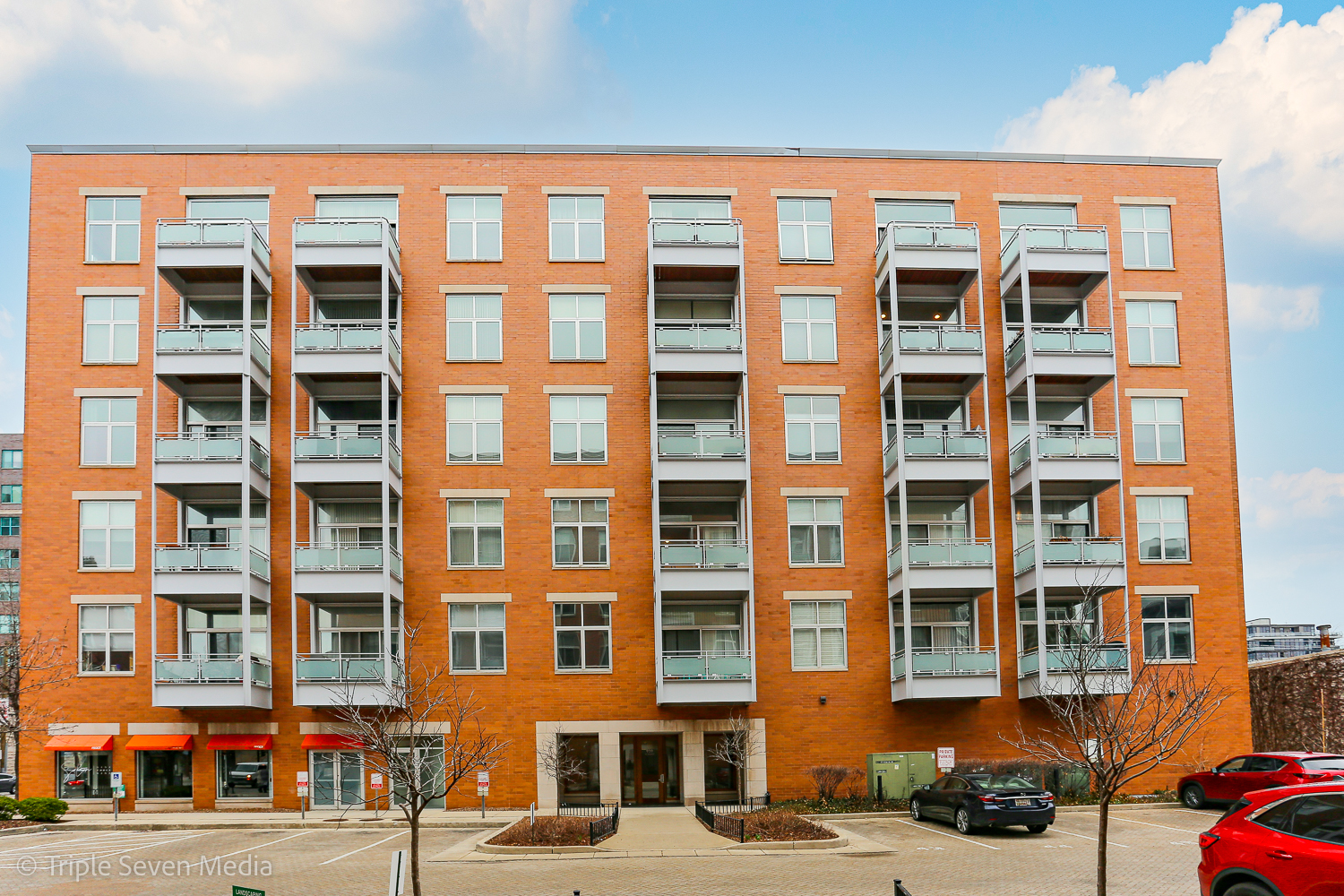 939 West Madison Street, Unit 206 Chicago, IL 60607 - Photo 1 of 20 a front view of a building with a street