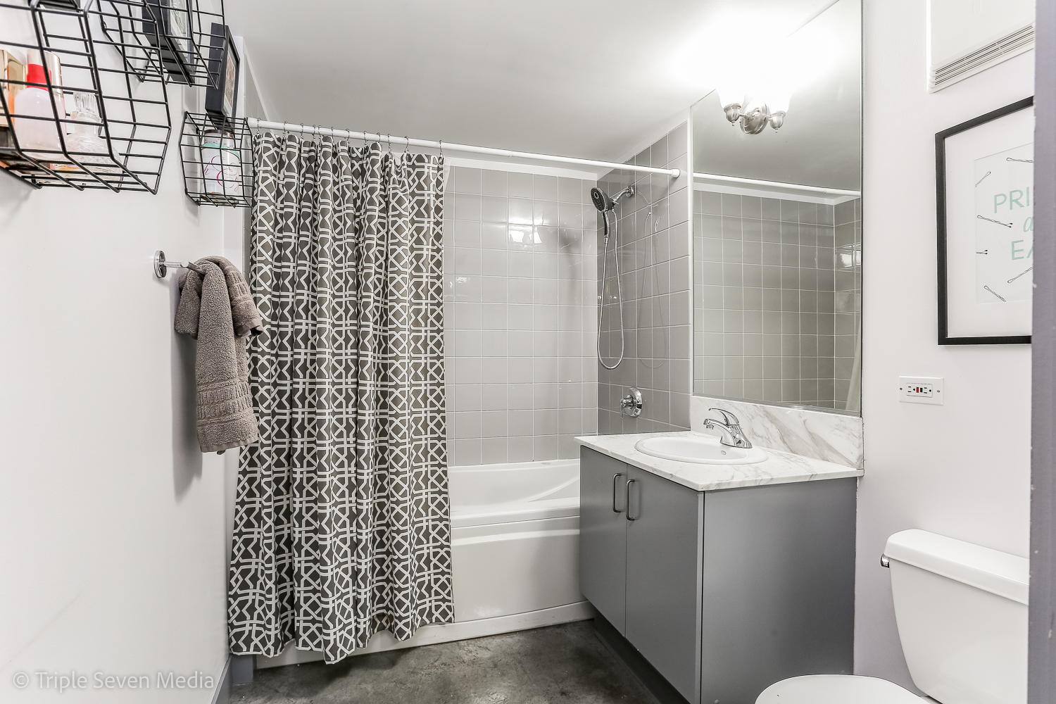 939 West Madison Street, Unit 206 Chicago, IL 60607 - Photo 12 of 20 a bathroom with a sink a toilet and shower