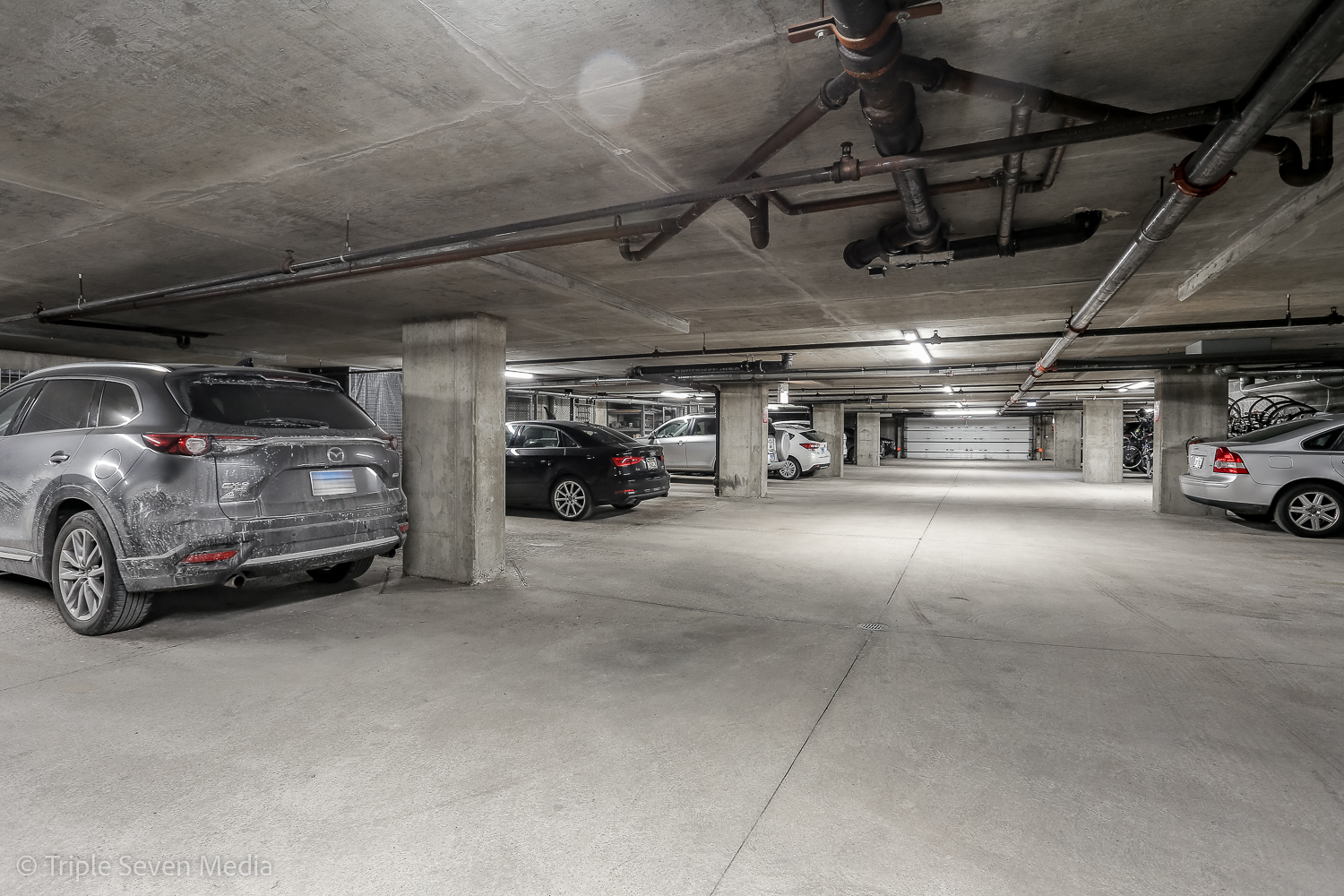 939 West Madison Street, Unit 206 Chicago, IL 60607 - Photo 19 of 20 a view of parking garage with cars