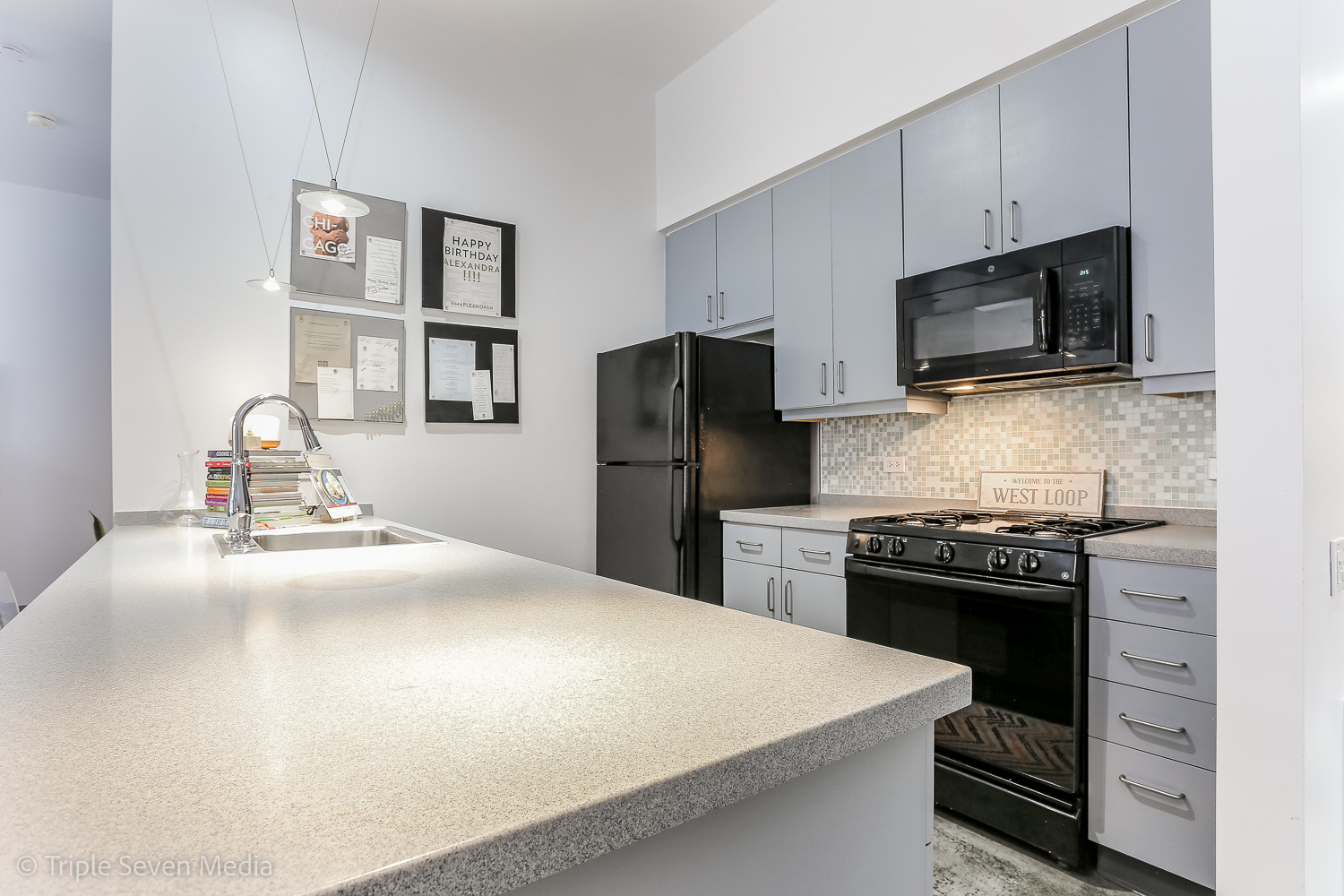 939 West Madison Street, Unit 206 Chicago, IL 60607 - Photo 7 of 20 a kitchen with a sink a stove and refrigerator