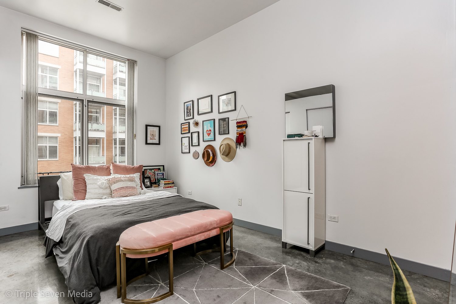 939 West Madison Street, Unit 206 Chicago, IL 60607 - Photo 9 of 20 a bedroom with a bed and a window