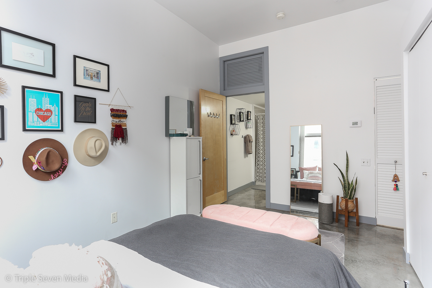 939 West Madison Street, Unit 206 Chicago, IL 60607 - Photo 10 of 20 a bedroom with a bed and a chandelier