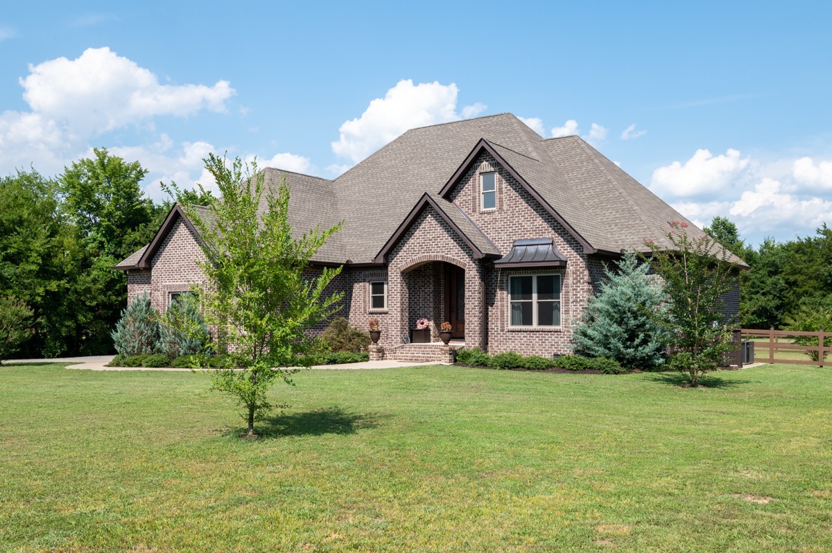 2793 Thompson Road Murfreesboro, TN 37128 - Photo 3 of 62 a front view of a house with a yard and garage