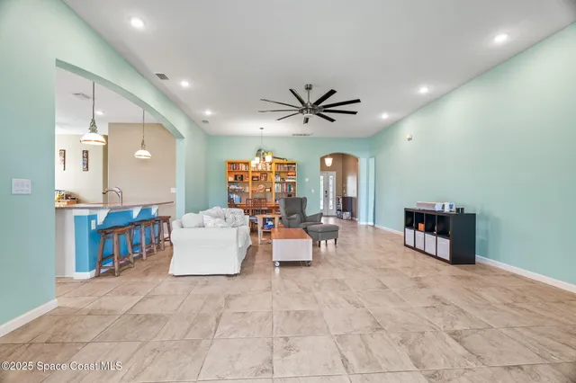 a bathroom with a granite countertop shower sink and mirror