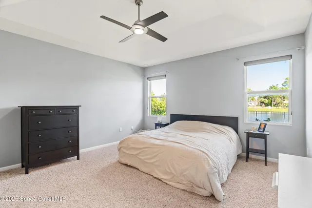 a bathroom with a tub a sink and a mirror