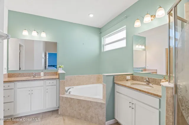 a view of a lake with a table and chairs