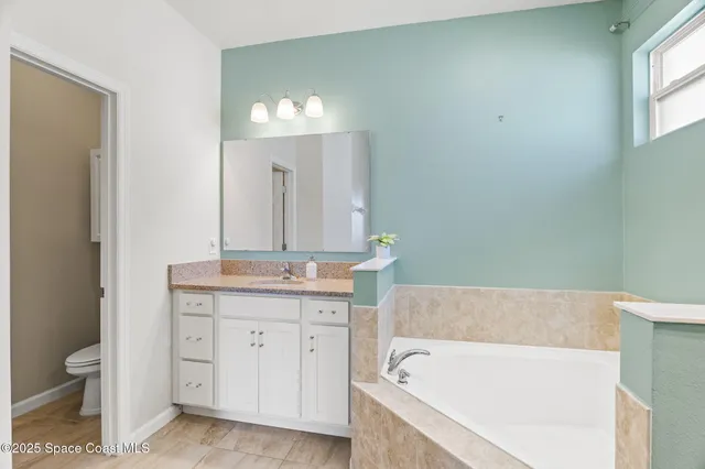 an aerial view of multiple houses with yard