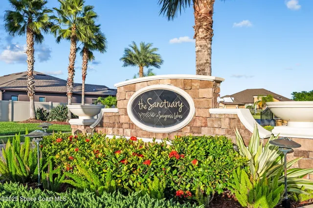an aerial view of residential house with outdoor space and swimming pool