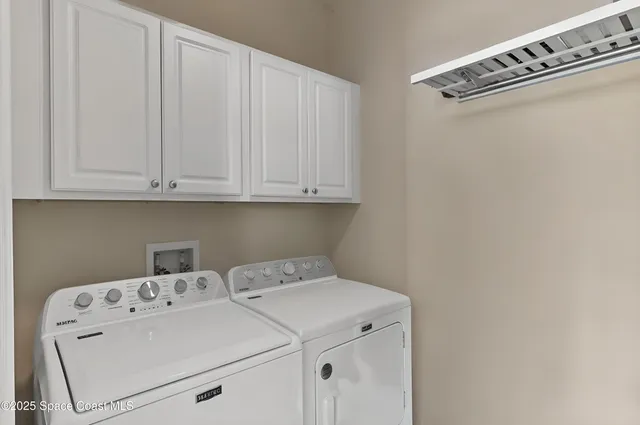 a view of a dining room with furniture and window