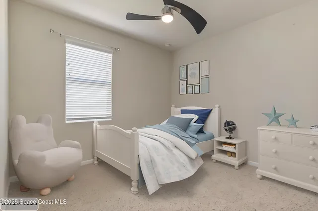 a bedroom with a bed a couch and a window