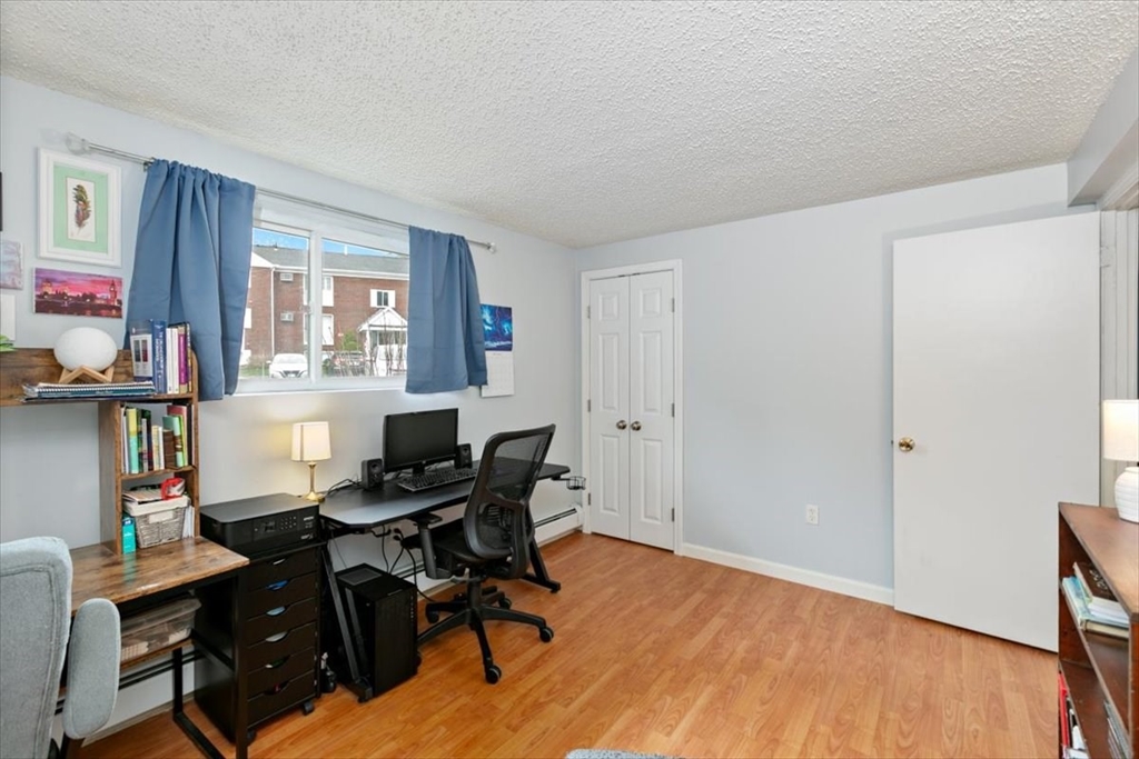 25 Clark's Road, Unit 101 Amesbury, MA 01913 - Photo 17 of 32 a view of a workspace with furniture and a window