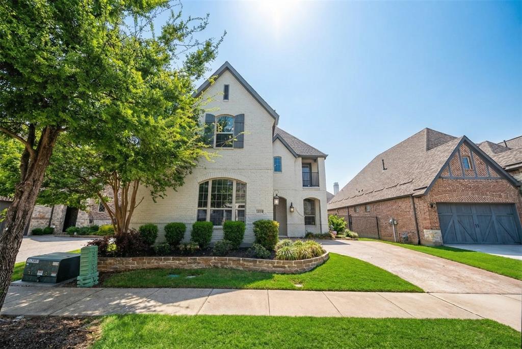 1039 Stephen Street Allen, TX 75013 - Photo 3 of 40 French country inspired facade with brick siding and concrete driveway