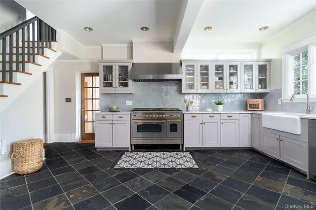 a kitchen with a stove a sink and a refrigerator