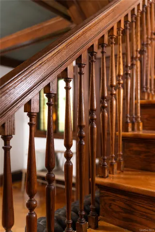 a bathroom with a granite countertop sink and a shower
