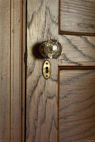 a bedroom with a large bed and a large window
