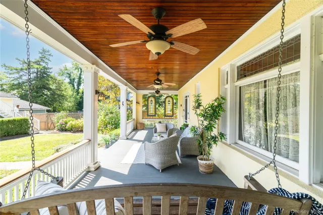 a view of balcony with furniture
