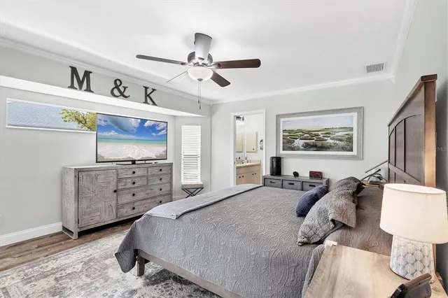 a bed room with a bed and a television