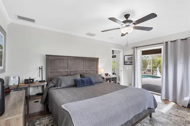 a bedroom with a large bed and a window