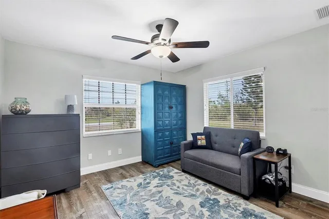 a living room with furniture and window
