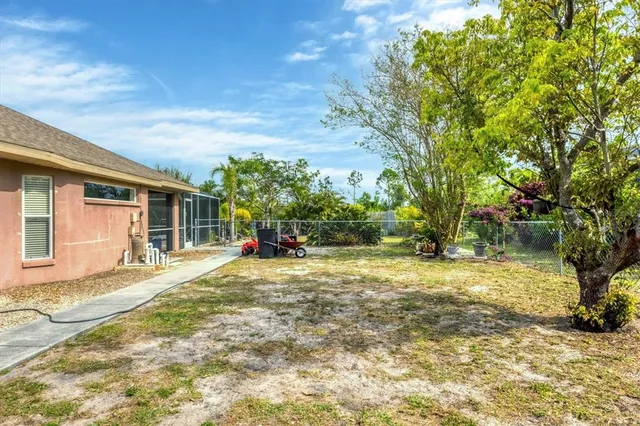 a view of a house with a yard and garage