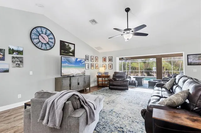 a bedroom with furniture and a large window