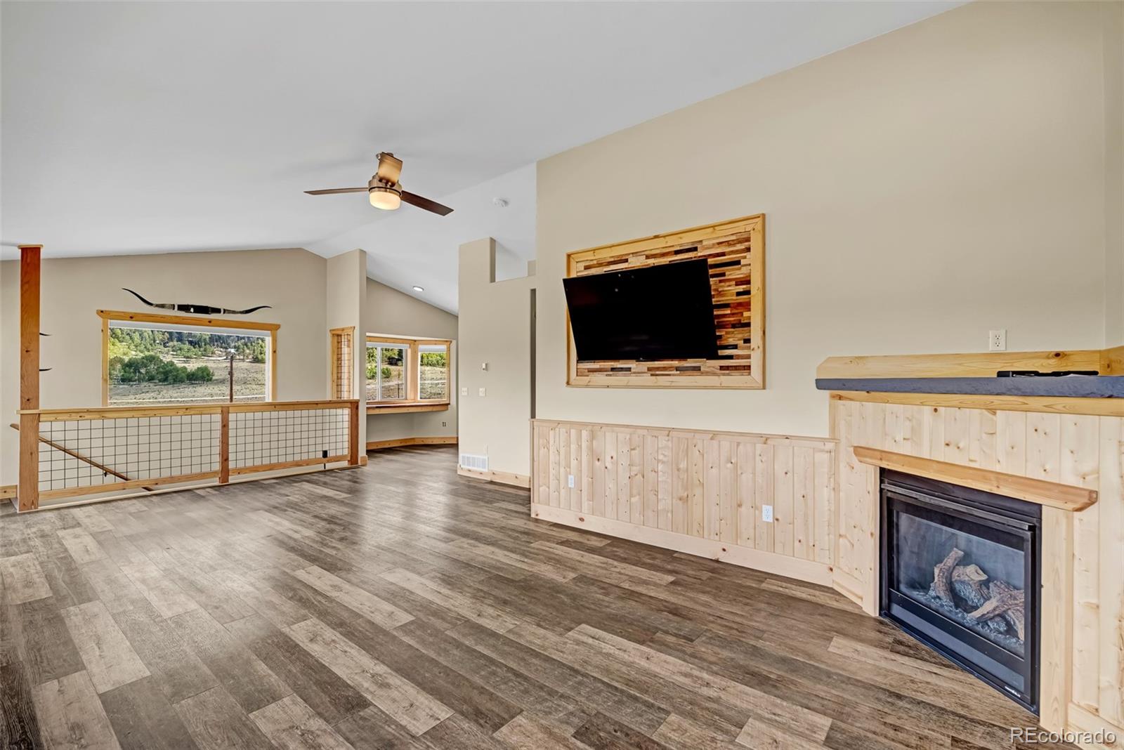 2491 Stagestop Road Jefferson, CO 80456 - Photo 2 of 46 a view of a livingroom with an empty space and a fireplace