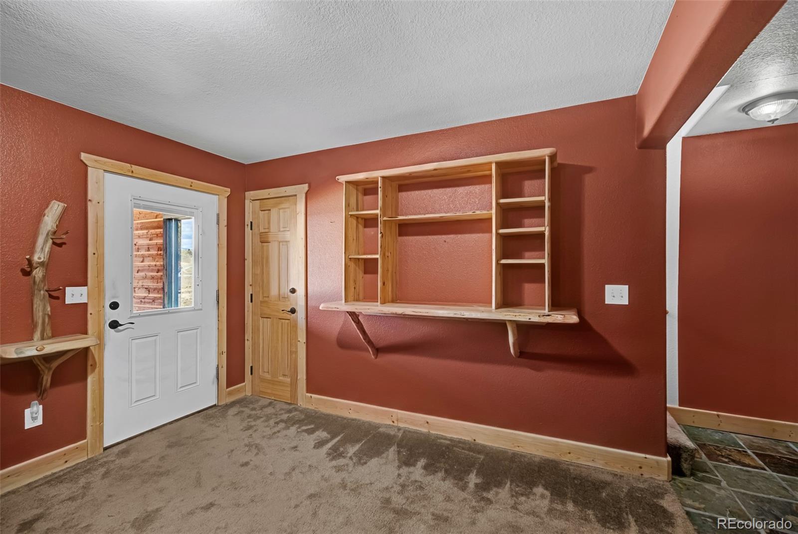 2491 Stagestop Road Jefferson, CO 80456 - Photo 21 of 46 an empty room with windows