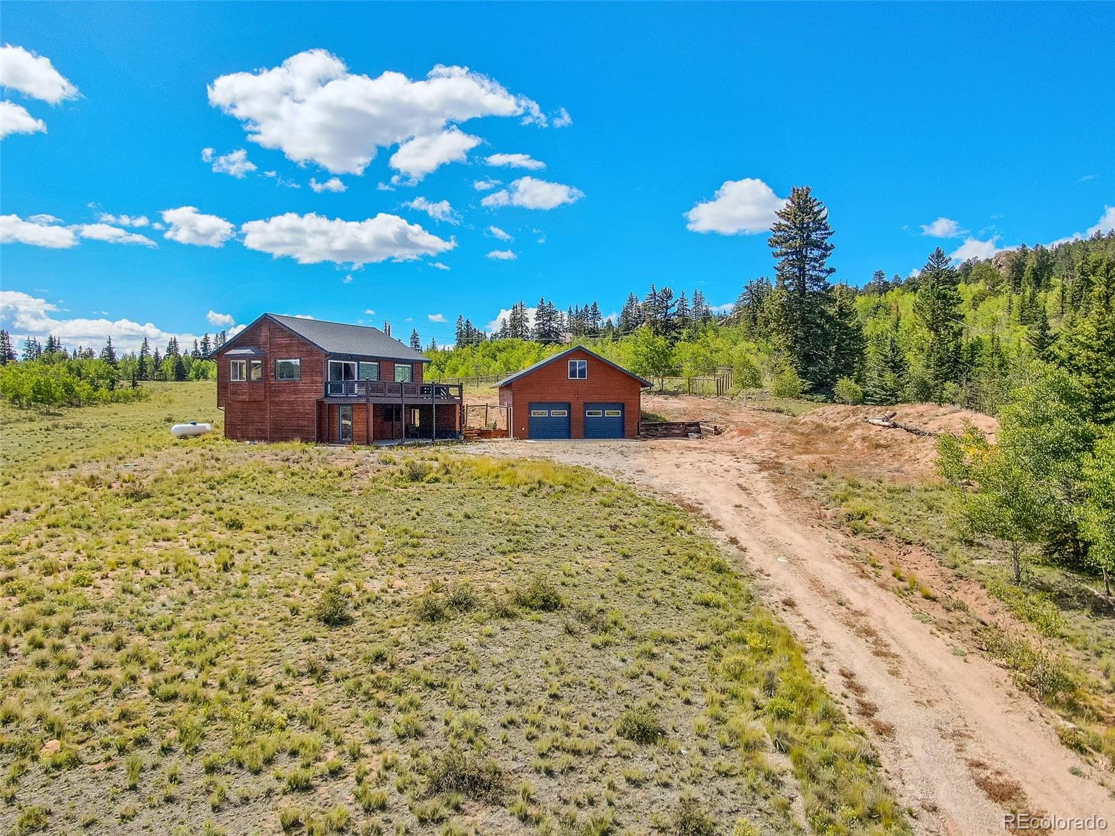 2491 Stagestop Road Jefferson, CO 80456 - Photo 36 of 46 a view of a house with a yard