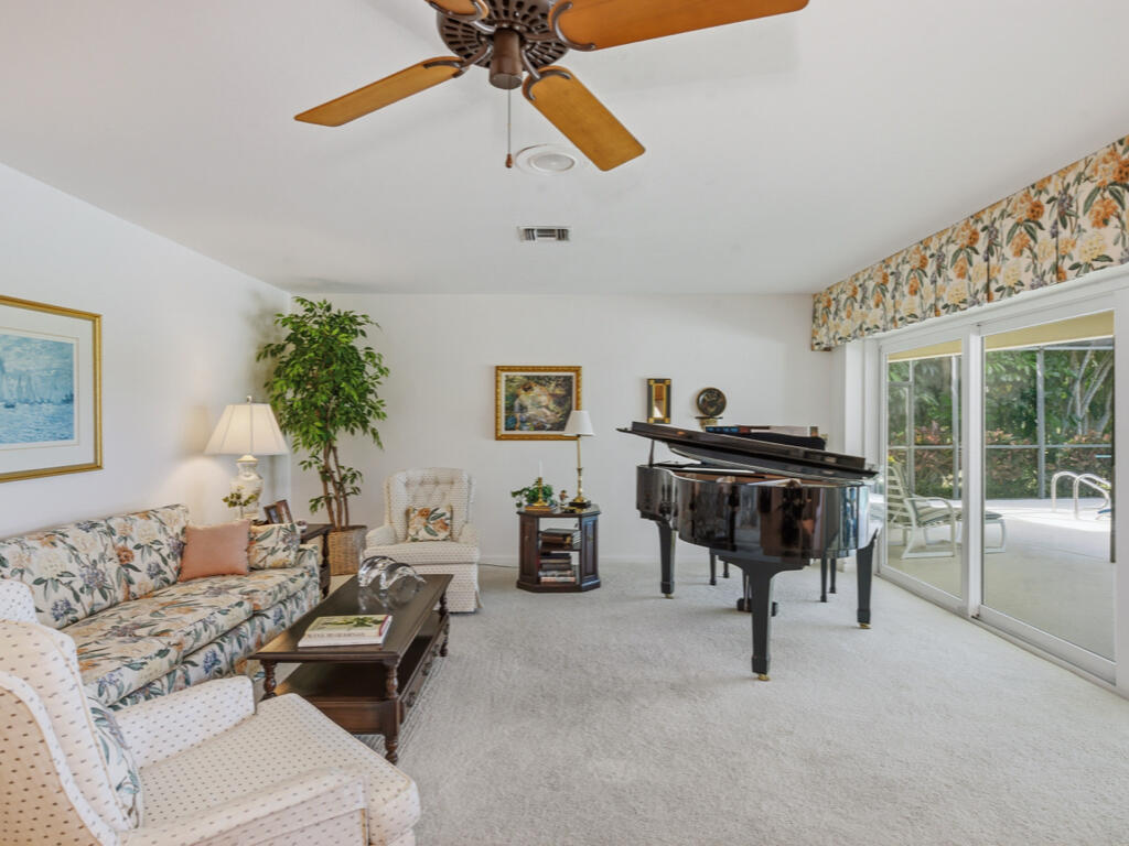314 Torrey Pines Point Naples, FL 34113 - Photo 3 of 21 a living room with furniture and a chandelier