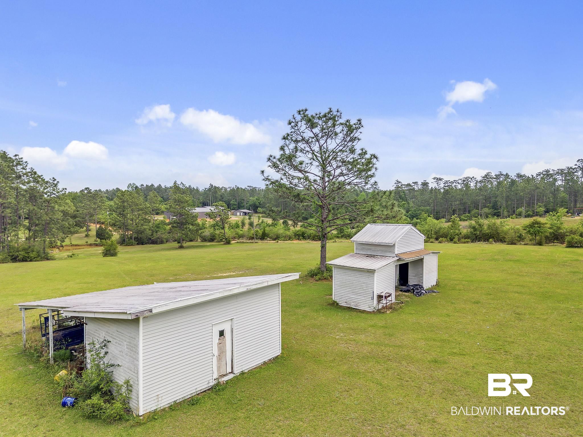 29792 County Road 65 Loxley, AL 36551 - Photo 6 of 39 Exterior space with a storage unit and an outbuilding