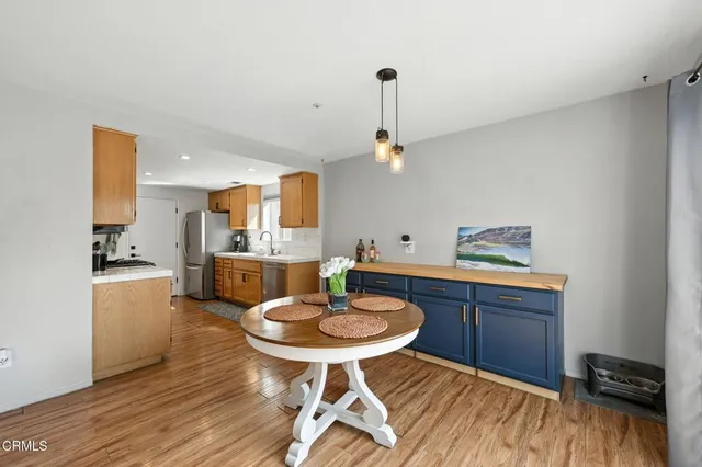 a kitchen with a table and chairs in it