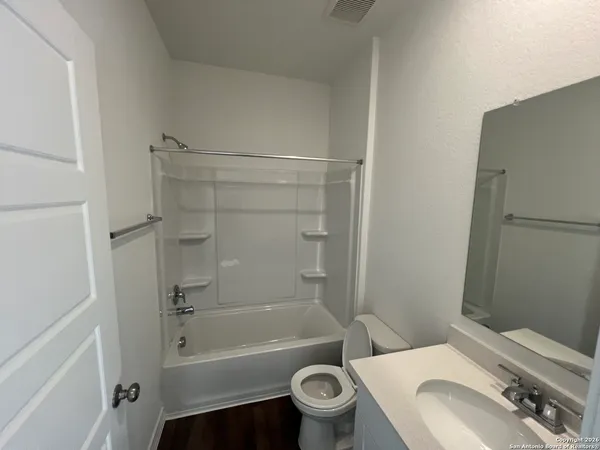 a bathroom with a sink toilet and bathtub