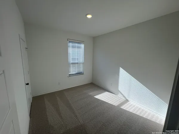 a view of an empty room and window