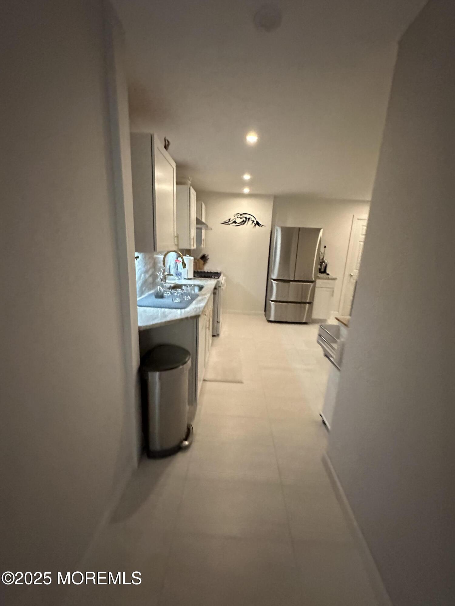 106 Wallace Street, Unit B Red Bank, NJ 07701 - Photo 15 of 19 a kitchen with stainless steel appliances granite countertop a sink and a refrigerator