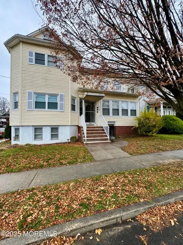 front view of a house with a patio