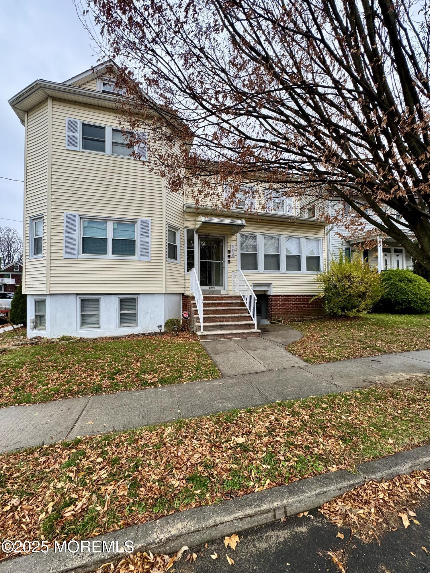 106 Wallace Street, Unit B Red Bank, NJ 07701 - Photo 17 of 19 front view of a house with a patio