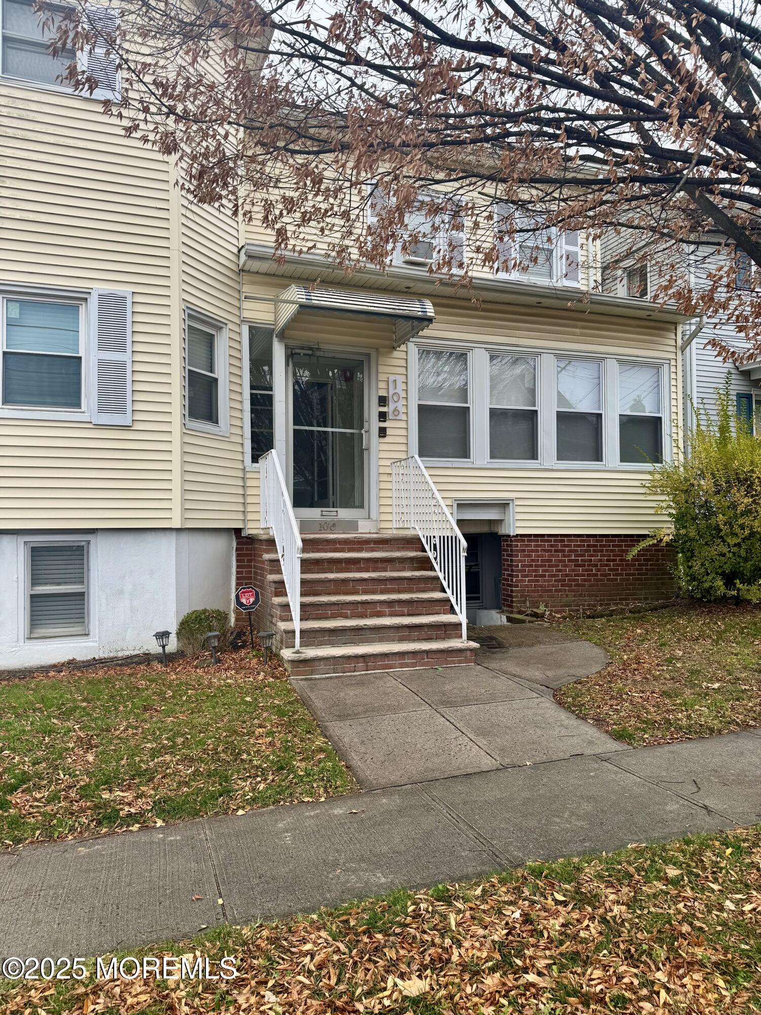 106 Wallace Street, Unit B Red Bank, NJ 07701 - Photo 18 of 19 a front view of a house with garden