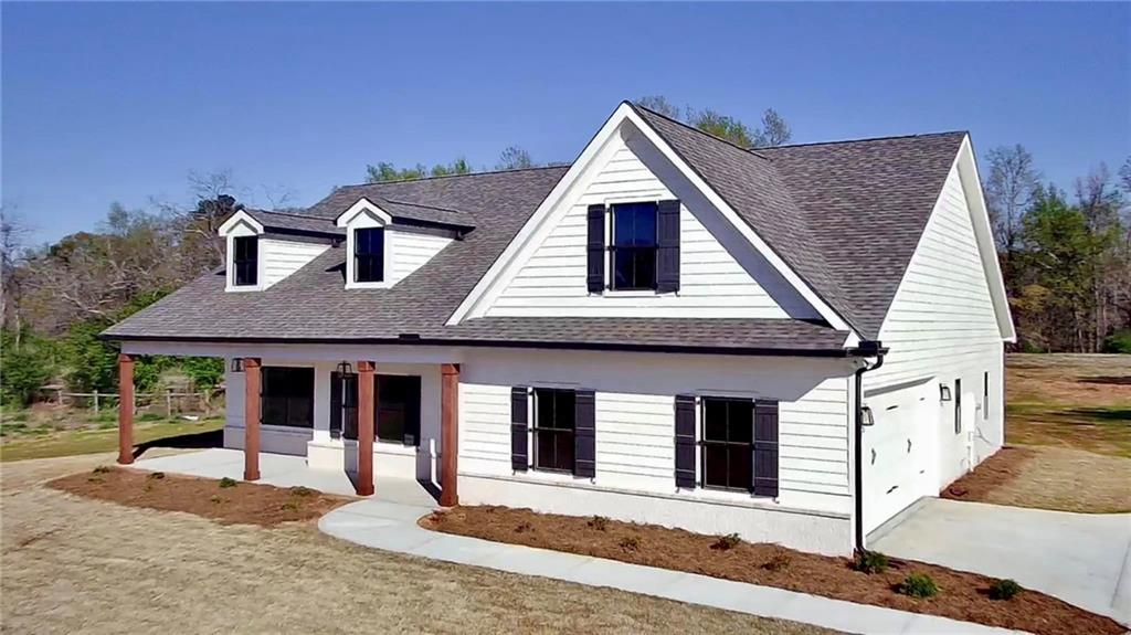 3857 Jersey Covington Road Covington, GA 30014 - Photo 1 of 1 a front view of a house with garden
