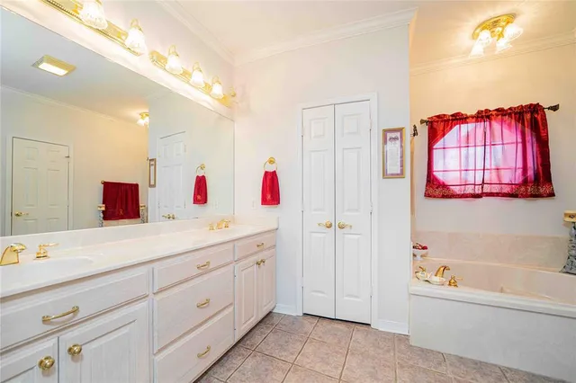 a bathroom with a bathtub sink and a mirror