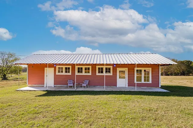 a front view of a house with swimming pool