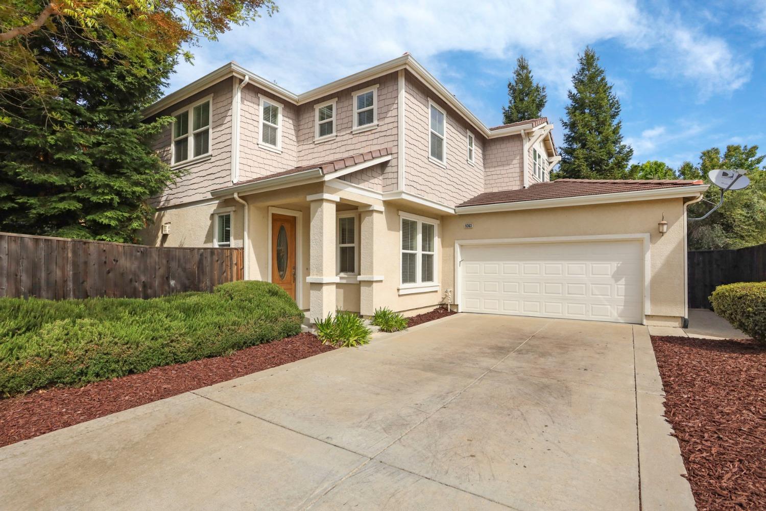 9363 Vintner Circle Patterson, CA 95363 - Photo 1 of 52 a front view of a house with a yard and garage