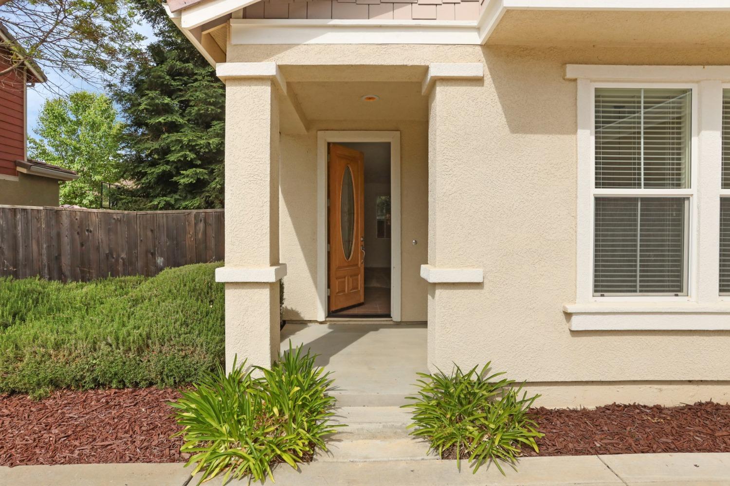 9363 Vintner Circle Patterson, CA 95363 - Photo 2 of 52 a front view of a house with a yard